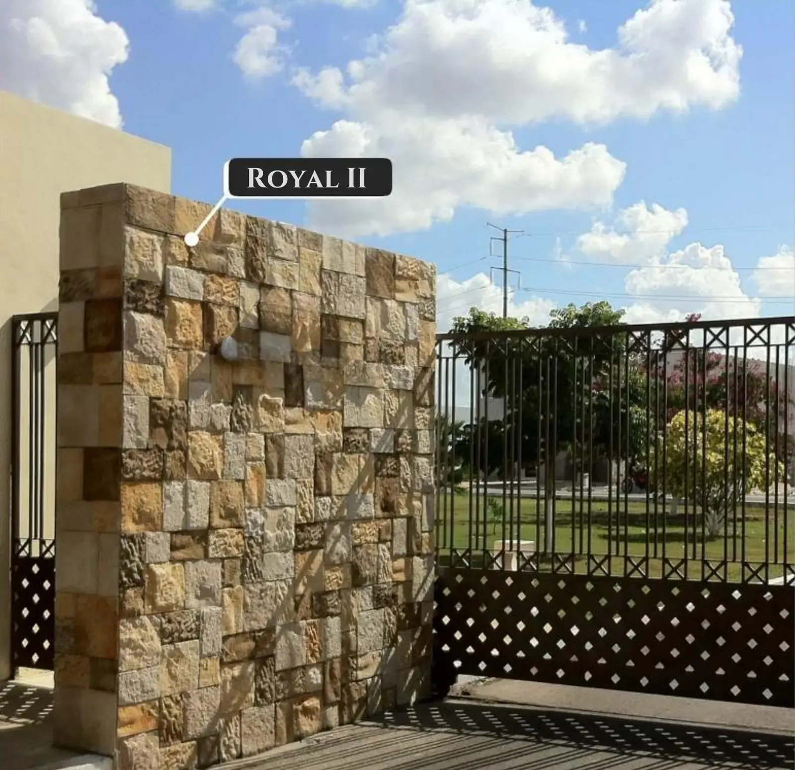 Stone-clad courtyard wall with lattice screen